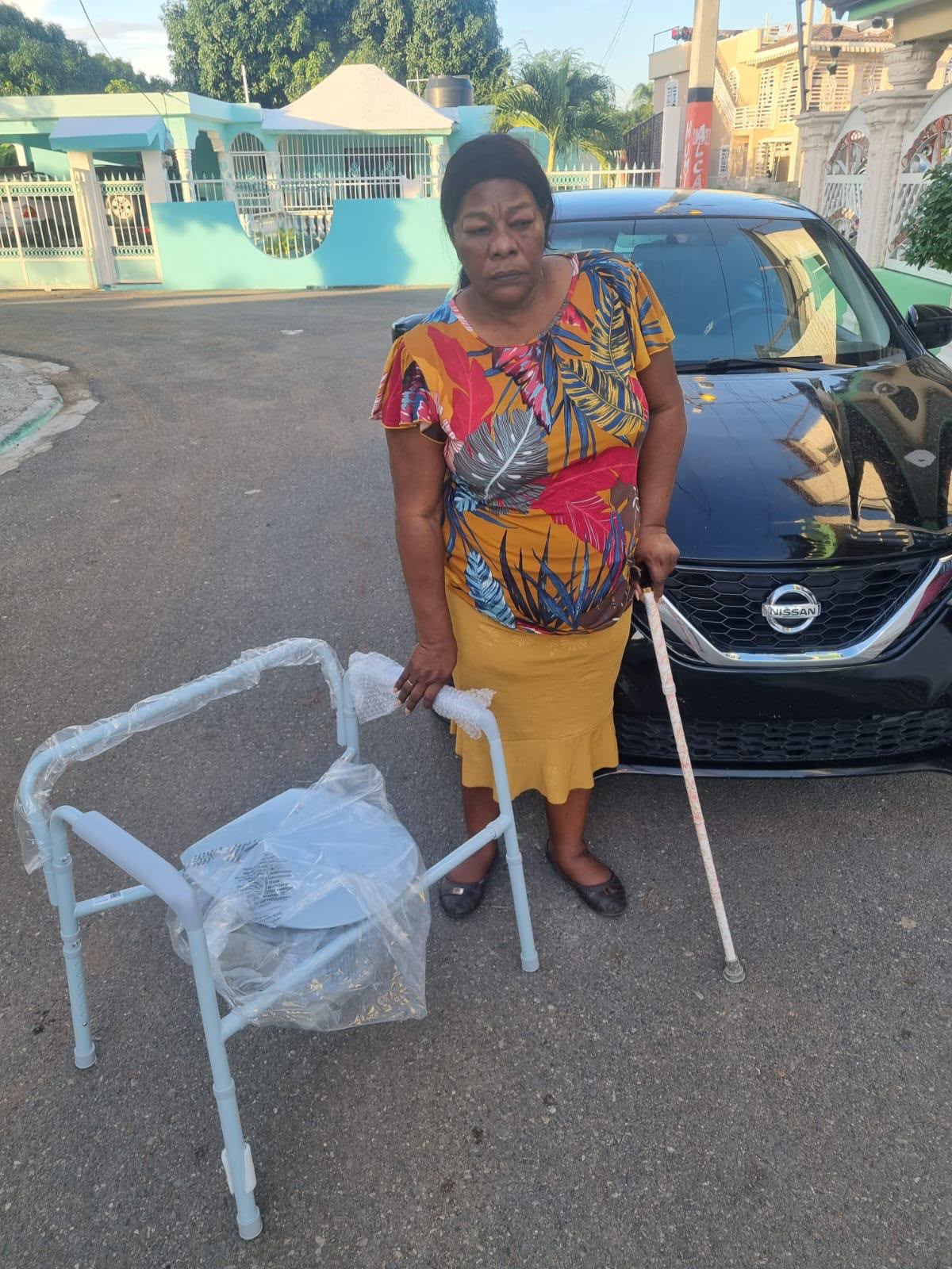 Commode chair and cane for an elderly woman